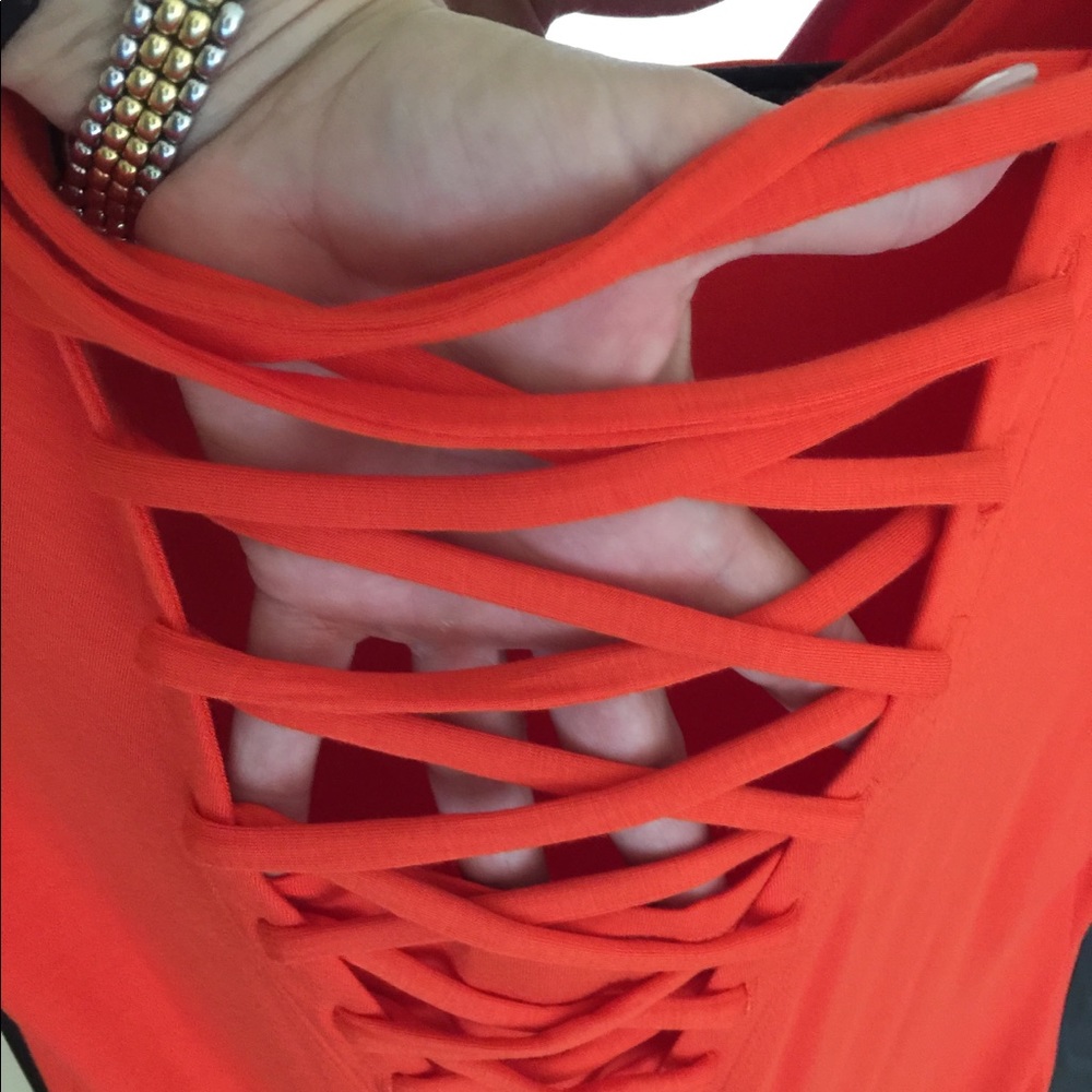 Red t-shirt dress with woven v neck to back.